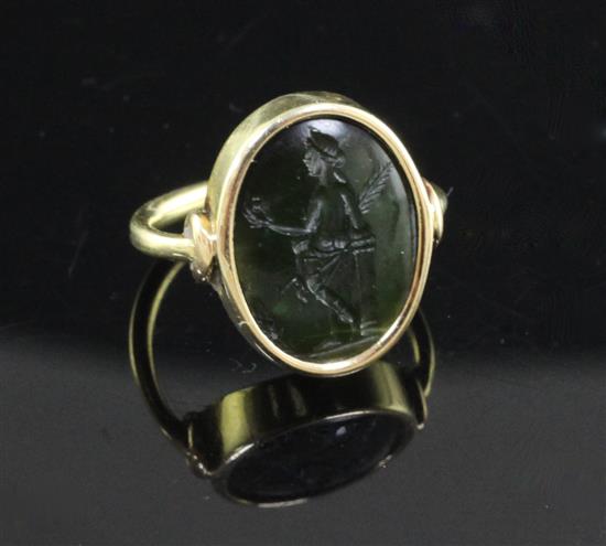A Roman green chalcedony intaglio in a later gold ring mount, size C.